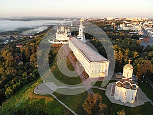 Photographed on drone at dawn. Sunrise and foggy. The Cathedral of Saint Demetrius and Dormition Cathedral in Vladimir.