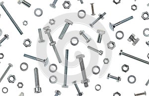 Photographed variety of metal bolts, nuts and rings on white backlit background. Seamless image to be repeated endlessly.