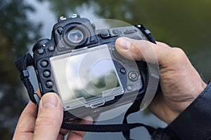 A photographer adjusts the camera