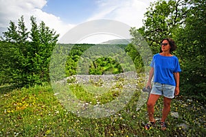 A photographer admire the forest in the park national of Vikos-Aoos