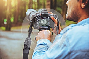 Photographer asian man travel  nature. Travel relax. Nature Study. At public park in summer. National park doi inthanon in