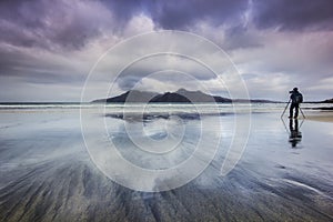 Photographer on the Bay of Laig - Isle of Eigg, Scotland.