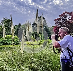 Photographer with camera in Briti park - Uckfield, UK