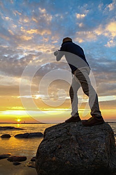 Photographer capturing sun rise photo
