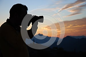 Photographer capturing the sunset