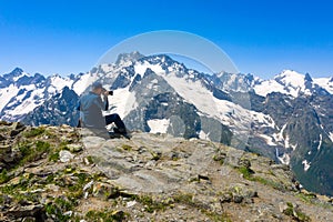photographer in the Caucasus mountains, mountainous territory, ski resort and nature reserve of the North Caucasus in