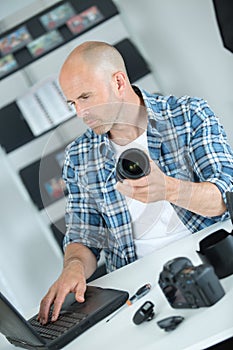 photographer checking how to clean camera online