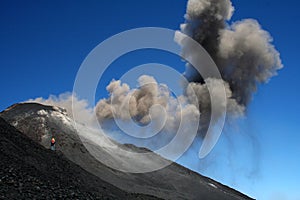 Photographer close to volcano etna photo