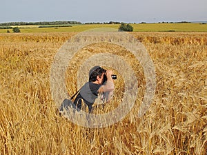 Photographer in cornfield photo