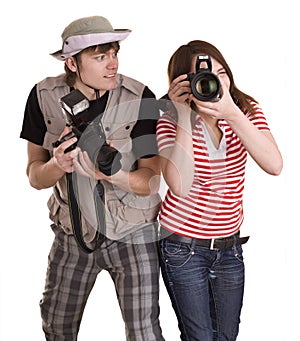 Photographer couple with digital camera.