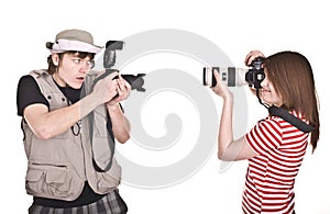 Photographer couple with digital camera.