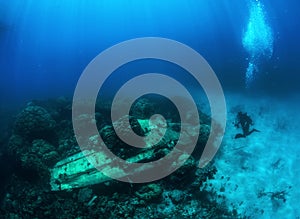 Photographer diver scuba take a photo of A6M Zero.