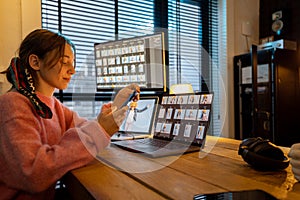 Photographer editing photos at home office