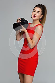 Photographer girl with dslr camera