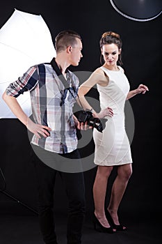 Photographer giving advice to female model