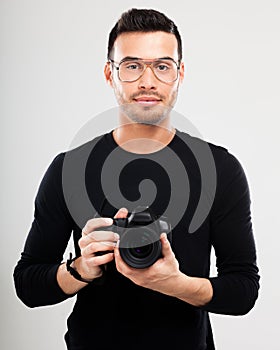 Photographer holding a reflex camera