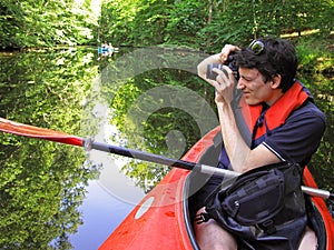 Photographer in kayak