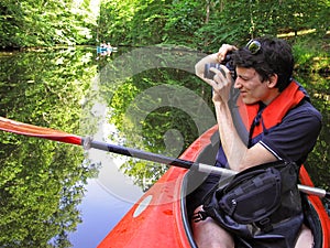 Photographer in kayak photo