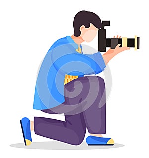 Photographer kneel with professional high resolution camera with removable lens at white background