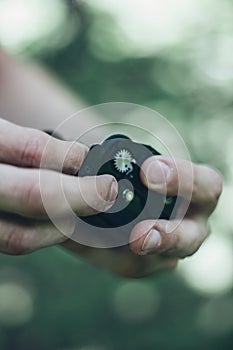 Photographer loading medium format film into the film back