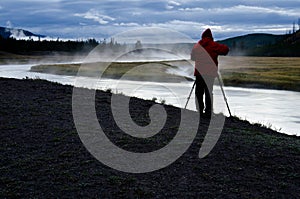 Photographer on Madison River in Yellowstone National Park