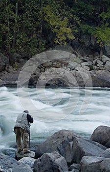 Photographer next to River