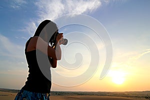 Photographer Photographing at Sunrise