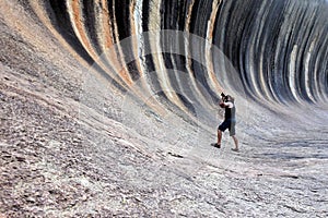 Photographer photographing the Wave rock in Hyden Western Australia