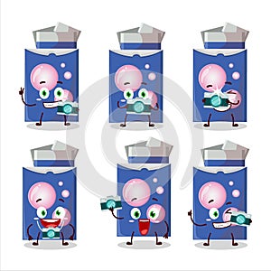 Photographer profession emoticon with blue bubble gum cartoon character