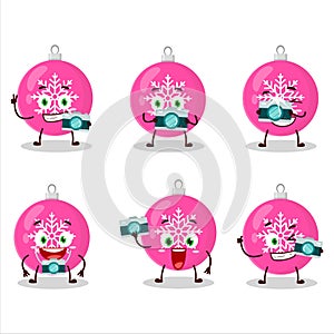 Photographer profession emoticon with christmas ball pink cartoon character