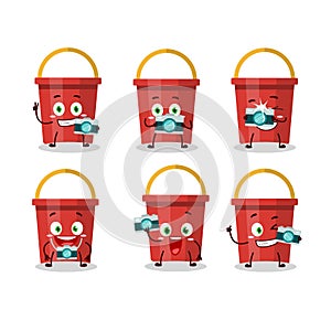 Photographer profession emoticon with sand bucket cartoon character