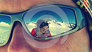 Photographer reflected on sunglasses while climbing MÃÂ¶nch mountain in the Alps, Switzerland