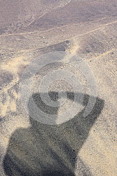 Photographer shadow on beach