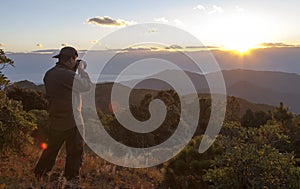 Photographer Shooting Mountain Sunset