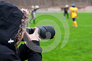 Photographer shooting rugby photo