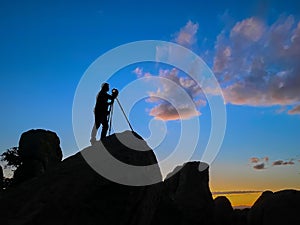 Photographer shooting sunset shot at City of Rocks, New Mexico USA