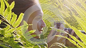 Photographer shooting wildlife among fern bushes