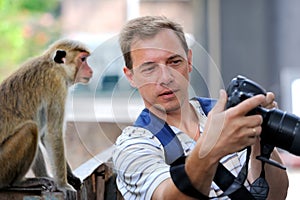 Photographer shows a monkey photo shoot