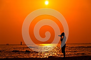 Photographer with sillouette on Hua Hin Beach photo