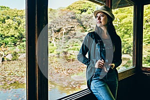 Photographer sitting relying by the window