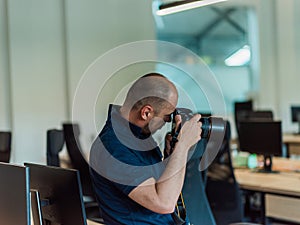 A photographer skillfully captures the essence of corporate life, focusing on business professionals in a modern office