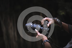 Photographer and sony camera in front of beautiful background
