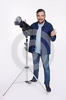 Photographer in studio isolated on white background