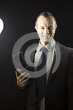 Photographer in studio in suit