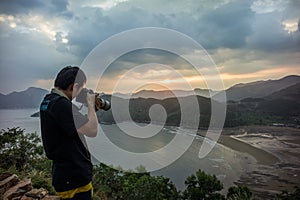 A photographer take photo at intertidal zone