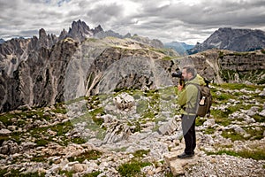 Photographer takes pictures of the mountain landscape