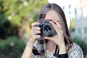 Photographer takes pictures with reflex camera