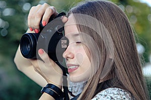 Photographer takes pictures with reflex camera