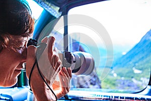 Photographer taking photo from camper car