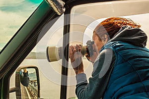 Photographer taking photo from camper car